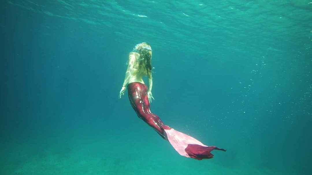 Island Mermaids Swimming with a Pink Mermaid Tail in Gili T