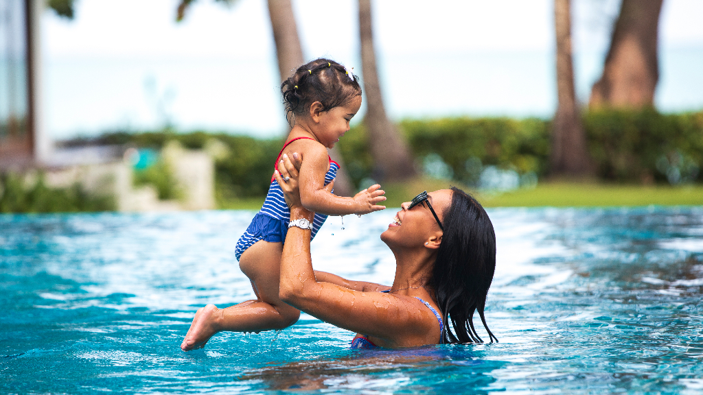 Mother and daughter swimming in the pool at Ban Suriya, Lipa Noi, Koh Samui, Thailand